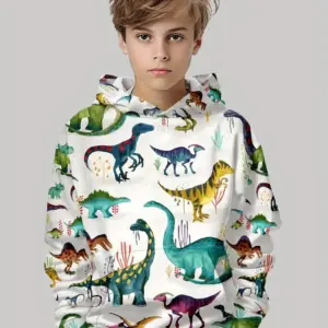 Junge in weißem Kapuzenpullover mit buntem Dinosaurier-Allover-Muster vor grauem Hintergrund