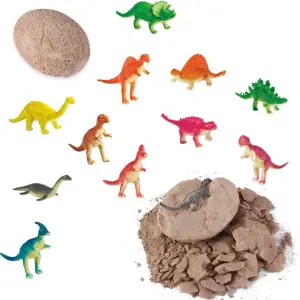 Dinosaurier-Ei zum Ausgraben mit bunten Dino-Figuren auf weißem Hintergrund