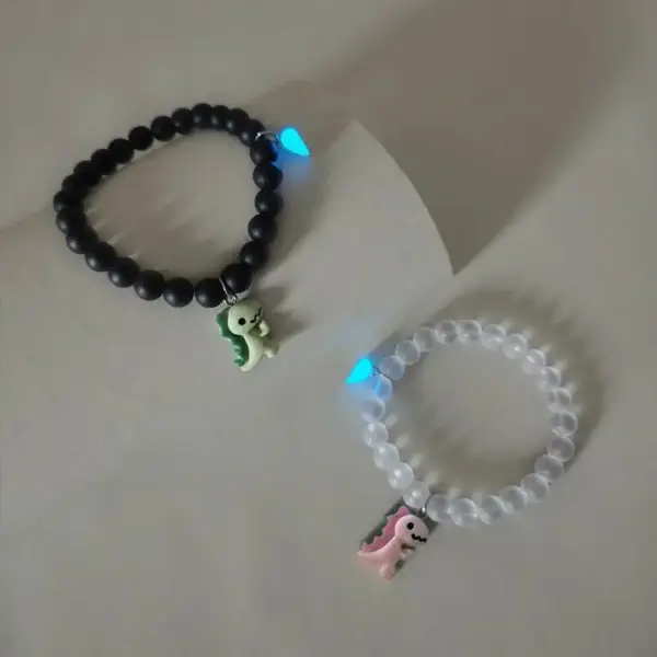 Partner-Armbänder mit Dinosaurier-Anhängern und Herz – Bild 3